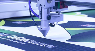 Laser cutting printed garments